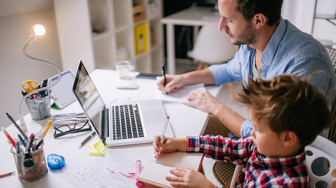 parent working from home with young child